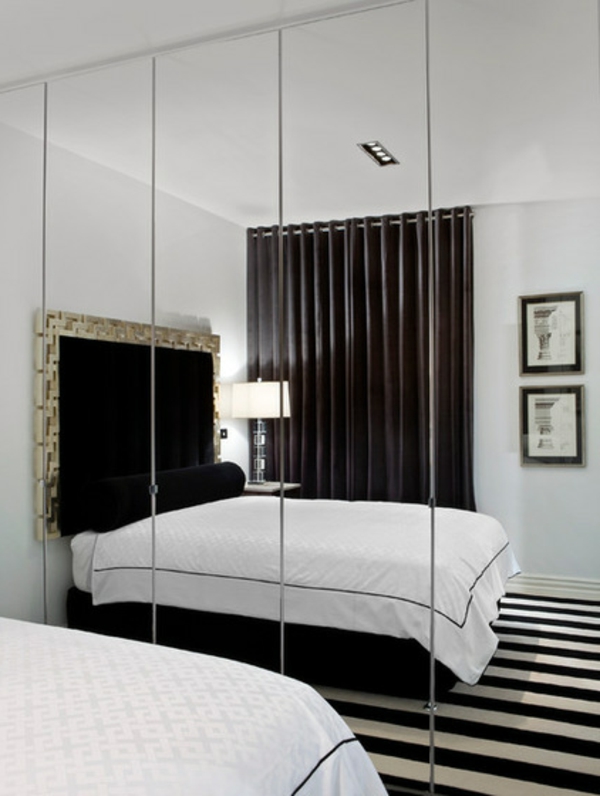 kleine Schlafzimmer größer aussehen bett spiegel weiß schwarz