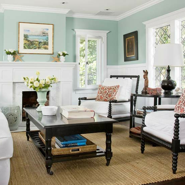 Wohnzimmer mit dekorativen Elementen tisch sofa bild grün kissen