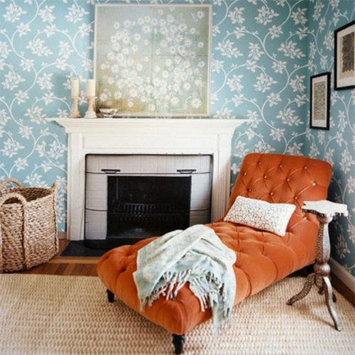 moderne inneneinrichtung orange wohnzimmer liege kamin blickfang farbe