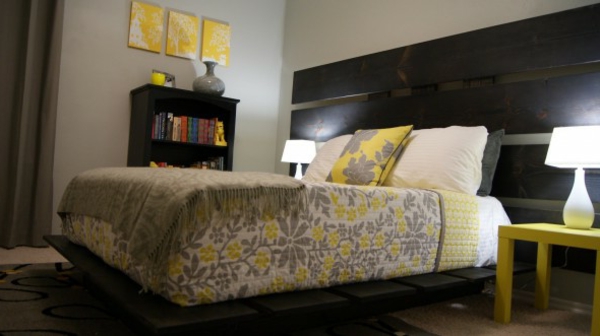 graues Schlafzimmer bett gelb lampe