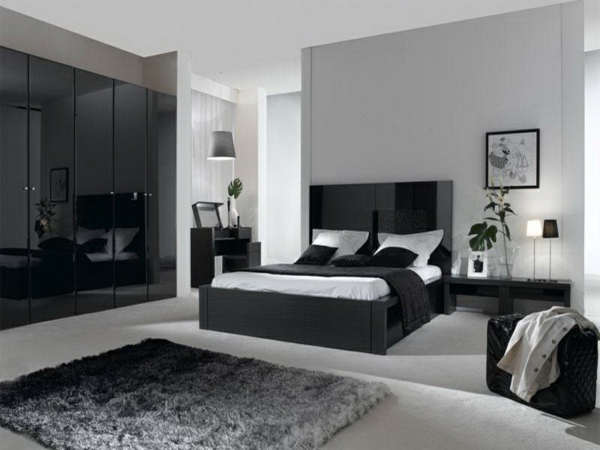 graue schlafzimmergestaltung schwarze elemente