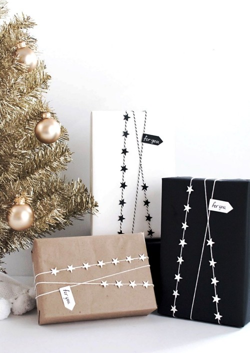 Weihnachtssterne selber basteln papier und seil girlande für geschenke