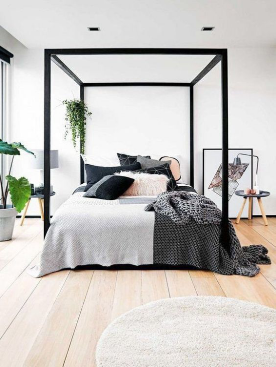 Dramatische Akzente in Schwarz modernes Schlafzimmer Himmelbett schwarzer Rahmen