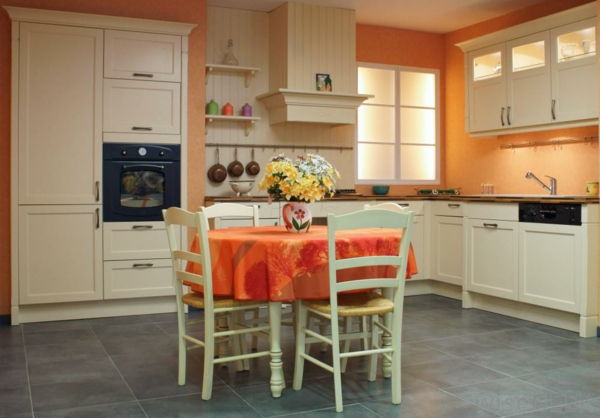 offene wohnküche orange küchenwände runder esstisch